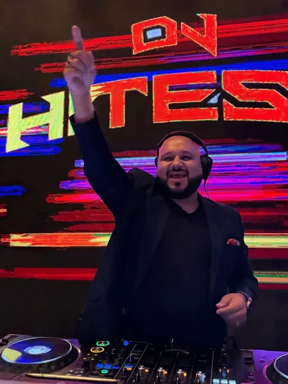 The only way to do great work is to love what you do. Here I am, one hand up, in front of a colorful, abstract LED display, fully immersed in the music.