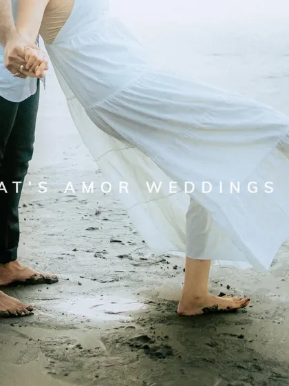 A close-up detail shot of a couple's feet in the sand, with the bride's white dress flowing. It’s a simple, romantic image that speaks volumes.