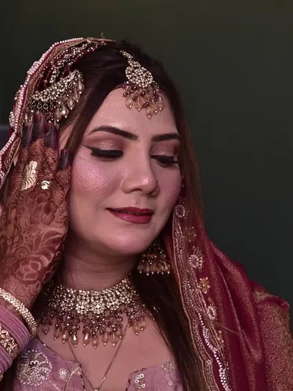 A candid moment of the engagement bride, with her eyes closed, looking serene and beautiful.