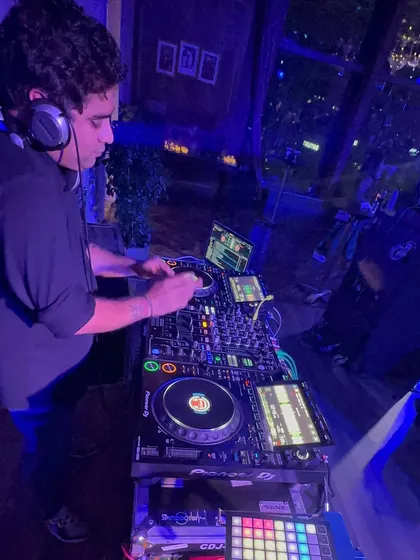 A quiet moment of focus before a set. I believe that music is a universal language built on respect for the craft, the artists, and most importantly, the crowd.
