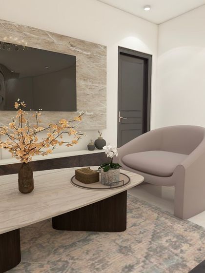 A close-up of the seating area in our ATS Pristine design. The combination of a dark sofa and light accent chairs creates a balanced look.