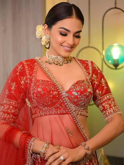 The soft smile and glowing skin are the highlights of this look. It's a perfect example of how makeup can enhance a bride's happiness on her wedding day.