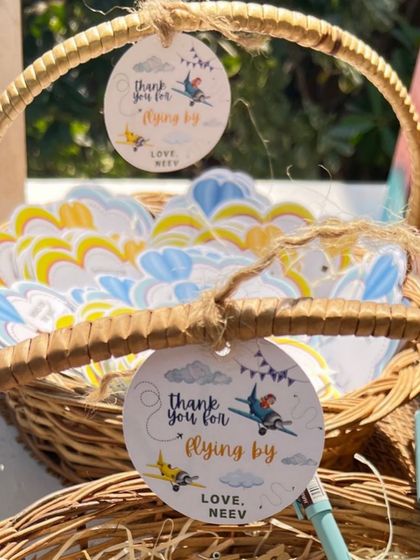 More custom tags for a first birthday, including cloud-shaped wish cards and airplane-themed thank you tags.
