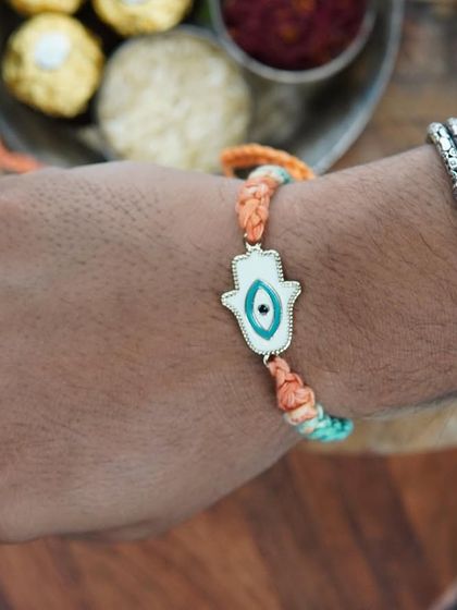 The Hamsa Rakhi, for protection and blessings. The evil eye in the center adds an extra layer of meaning.