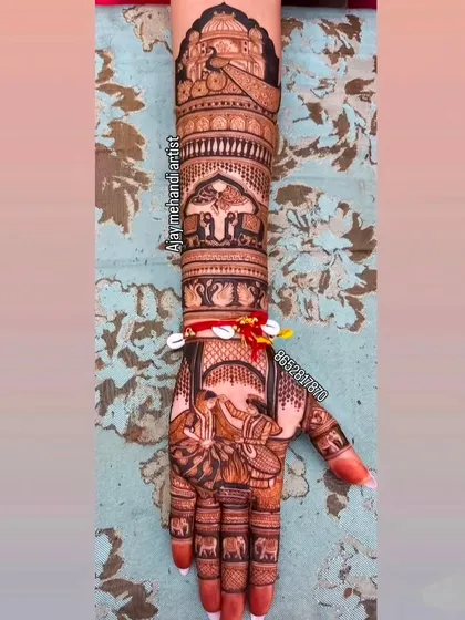 A full-arm design telling a wedding story, with a bride and groom on the palm and a doli procession on the arm.