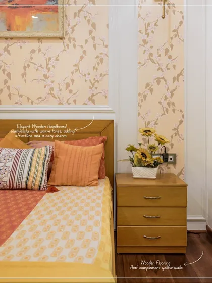 A close-up of the bed and nightstand from image 24, highlighting the wooden headboard and sunflower decor.