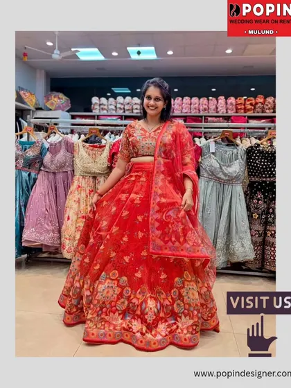 This bright red floral lehenga is perfect for a wedding guest who wants a classic yet fresh look. The lightweight organza fabric makes it comfortable for long hours of celebration.