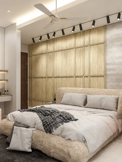 A cozy retreat where every detail tells a story. This bedroom features a plush, fur-textured bed, a compact study corner, and a full-wall wooden wardrobe, creating a warm and multi-functional personal space.