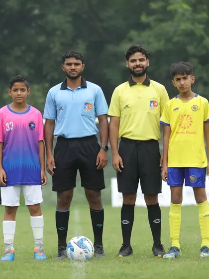 The pre-match handshake between our U13 captain and the opponent from Bhagat Singh FA, a symbol of fair play.