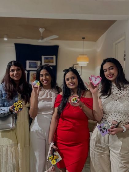 A fun night out for a group of friends. They each painted their own coasters, creating a set of personalized and functional art to remember their time together.