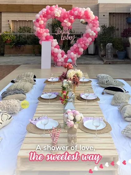 A shower of love for the bride-to-be! We created this Beyoncé-inspired bridal shower with a heart-shaped balloon backdrop and a dreamy boho sit-down picnic setup on a sunny terrace. It was the perfect setting for a flawless "final fling before the ring."