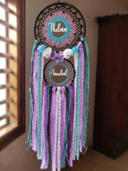A galaxy-themed dreamcatcher we customized for 'Thelma' and 'Aanchal'. The deep purples and blues create a celestial vibe, making it a unique and magical piece for a shared space.