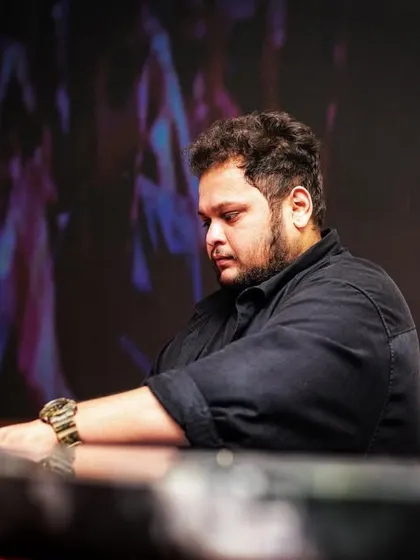 A moment of concentration at the decks before the drop. Every set is a journey, and every track is chosen with purpose.
