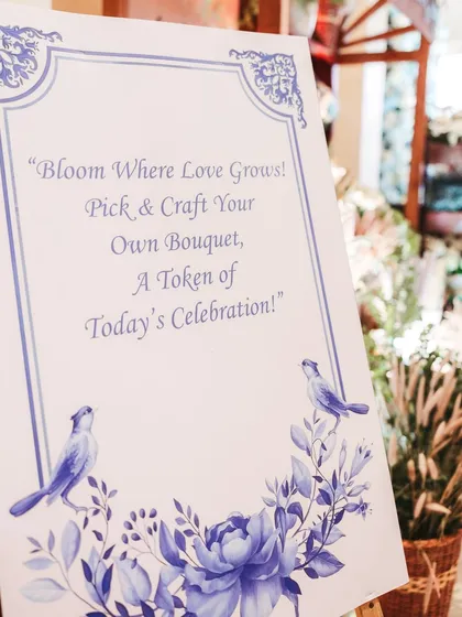 A sign for the "Make Your Own Bouquet" station, inviting guests to engage with the decor and create a personal keepsake from the celebration.