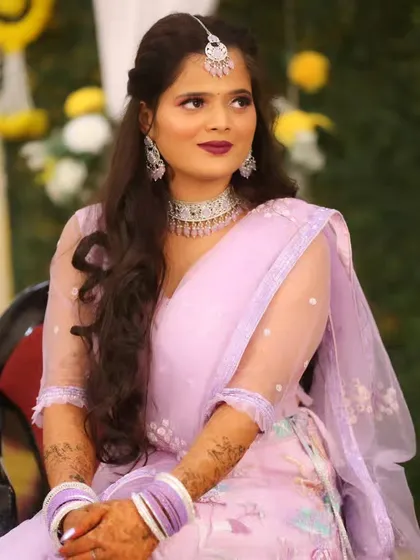 A close-up of the sangeet look, showing the soft waves in her hair and the elegant diamond jewelry.