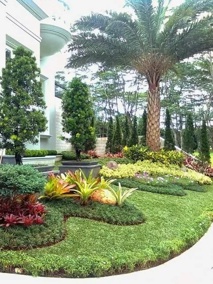 A beautiful example of layered planting with a mix of colors, textures, and heights. We use this technique to create visually rich gardens that look full and natural.