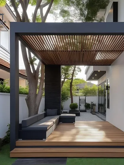 A cantilevered rafter pergola creates a stylish and functional covering for this wooden deck. The design requires fewer support posts, resulting in a clean, open feel that seamlessly connects the indoor and outdoor areas.