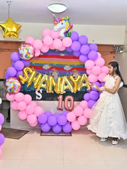 Another shot of the birthday girl enjoying her magical Unicorn party setup.