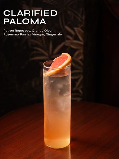 A Clarified Paloma from our limited-time Bacardi menu. This clear, crisp cocktail features Patrón Reposado, orange oleo, and a unique rosemary parsley vinegar.
