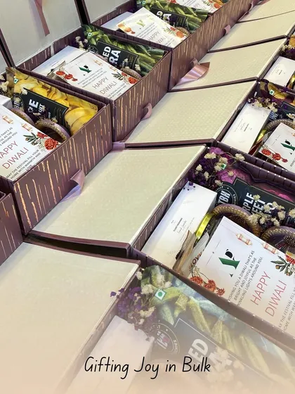 Gifting joy in bulk is what I do. Here's another angle of a large festive order, with each box carefully packed with a variety of goodies, ready to spread happiness during the holiday season.