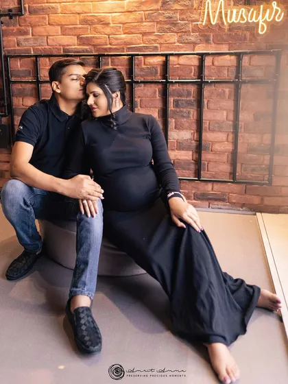 An intimate and modern couple's portrait. The industrial chic background provides a unique contrast to the tender moment shared between them.