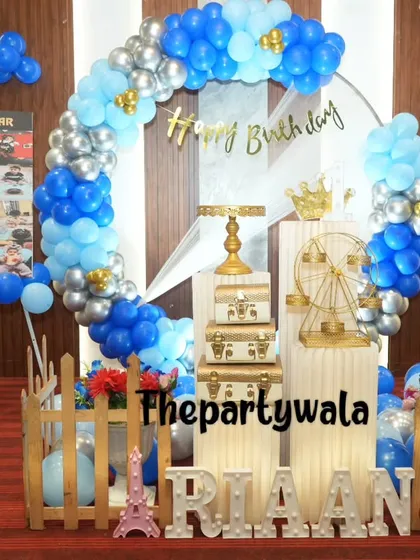 Another view of the blue and silver ring decoration, showing the "My First Year" photo board, which is a great way to personalize the celebration.