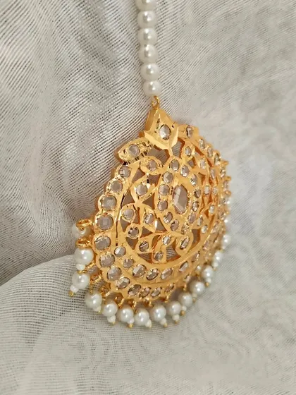 Another angle of the 'Ujwala' Mangtika, showing its delicate craftsmanship.