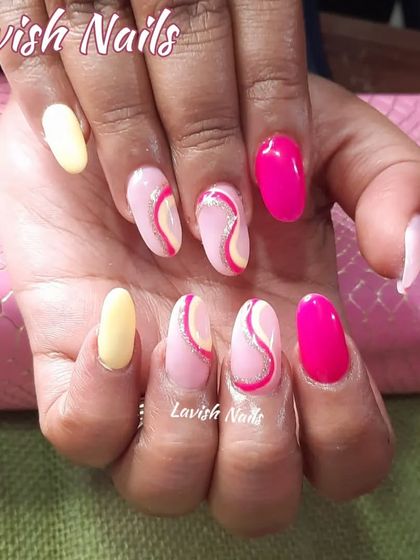 A bright and colorful abstract design with pink, yellow, and glittery swirl accents.