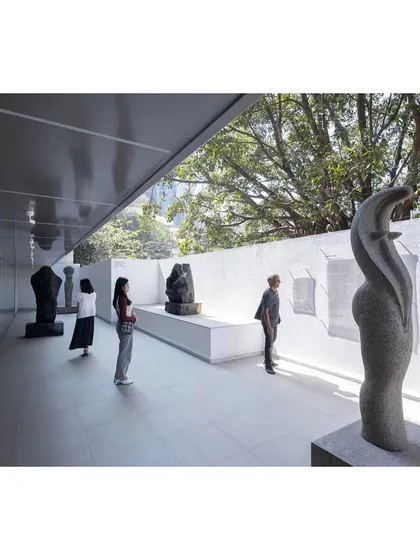The sculpture court at MAP, a transitional space between the interior galleries and the city. We designed this area to be a quiet, contemplative zone, using natural light and a simple material palette to highlight the art and create a serene public experience.