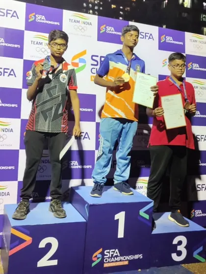 Our archer proudly accepts his silver medal in the U-17 Indian round at the SFA Championships.
