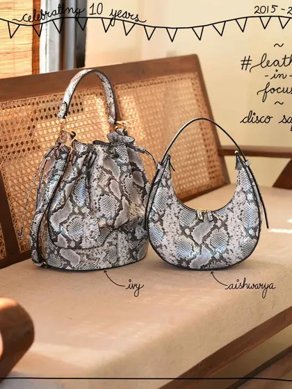 Here are the Ivy and Aishwarya bags in our statement Disco Safari leather. The silver and grey tones of this exotic snake print are surprisingly versatile for everyday wear, adding a touch of glamour to any outfit.