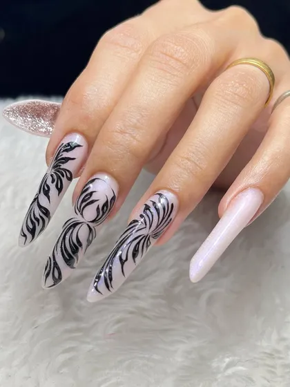 This is the level of artistry you can achieve. We teach advanced techniques like the Russian Edge, focusing on precise shaping and intricate freehand designs that will set you apart as a nail technician.