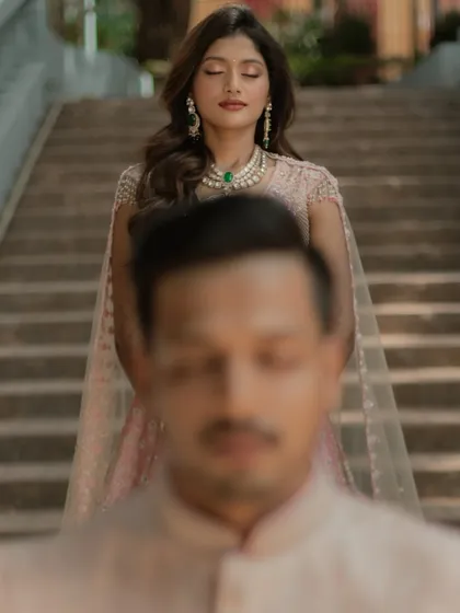 A creative and serene portrait with the bride in sharp focus in the background and the groom softly blurred in the foreground.