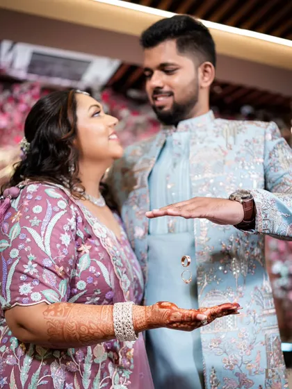 A close-up of the creative "floating ring" shot, capturing the couple's loving gaze and the magical moment of their engagement.