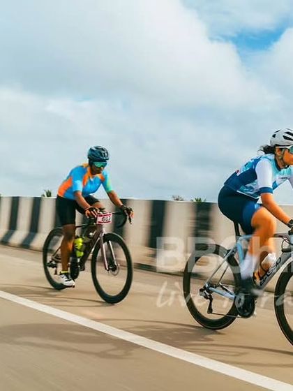 Three female riders in a breakaway, working hard to stay ahead of the chasing pack. This is a gutsy move that could lead to victory.