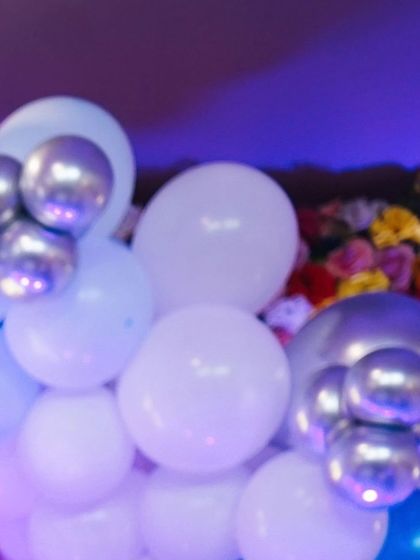 More details of the lovely balloon and flower arrangements, showing how different colors and textures were combined for the party decor.
