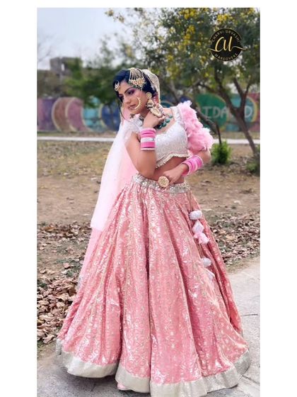 A full-length shot of a client in a sparkling pink sequin lehenga. This is a super popular choice for sangeet or reception nights, and I have the perfect diamond-look jewellery to go with it.