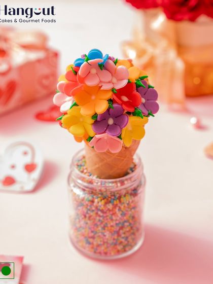 Ever imagined a cupcake in an ice cream cone? For Valentine's Day, we created this special treat with our signature vanilla cupcake and French buttercream, topped with edible flowers.