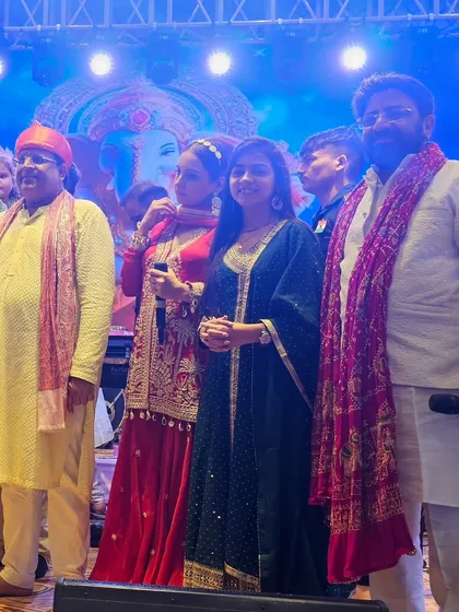 Sharing the stage with esteemed guests during a Ganpati Mahotsav. My live music services are perfect for large scale community and religious gatherings.