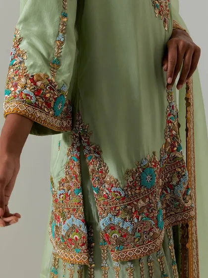 A close-up look at the soul of my collection: the craftsmanship. This shot highlights the multi-colored threadwork, sequins, and beadwork that bring our designs to life, turning fabric into art.