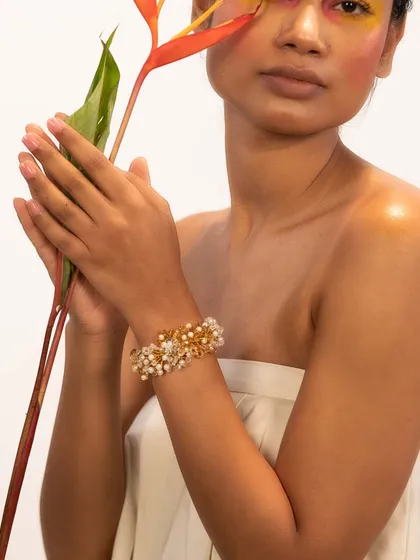 Enhance your wrist with our classic crafted bracelets, like this one featuring pearls and gold beads.