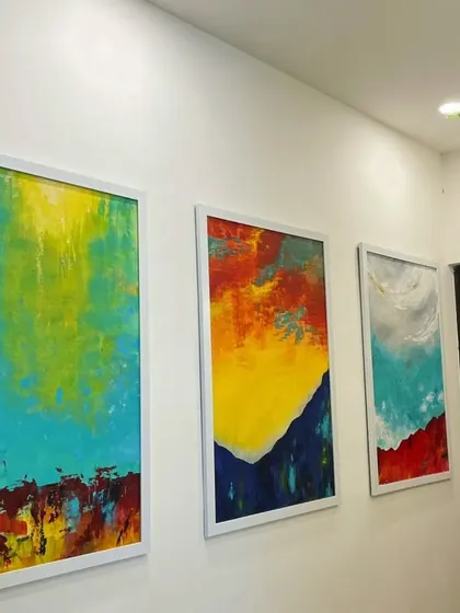 This triptych of modern abstract paintings shows my love for bold colors and textures. Created with acrylics on large canvases, these pieces were commissioned to be the vibrant focal point of a hallway, adding energy and personality to the home's decor.