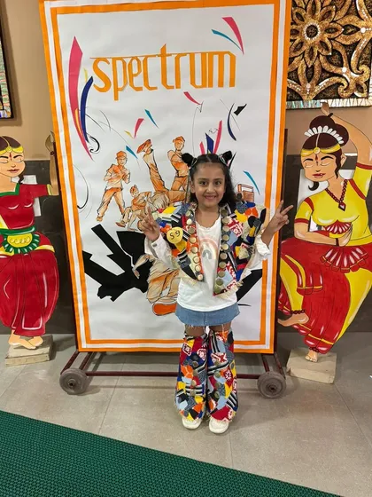 Our winning student poses in her creative, self-designed outfit for the 'Future Dreams and Parade' event at the inter-school competition. Her creativity and confidence won the day.