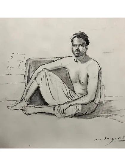 A full-figure life sketch using charcoal. This kind of study is essential for understanding anatomy and posture. It's a raw, quick sketch that captures the relaxed pose of the subject.