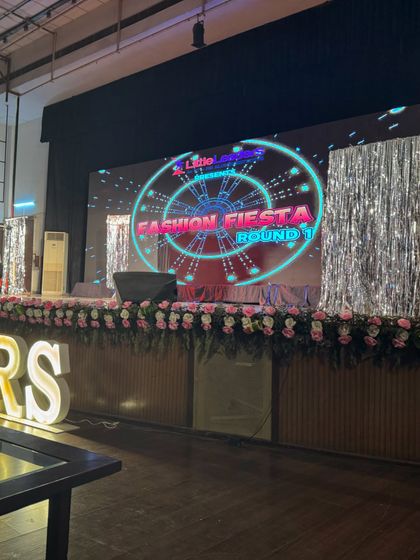 The stage is ready for the Fashion Fiesta round at the annual day. In addition to dance, we also help choreograph and manage other performance segments for school events.
