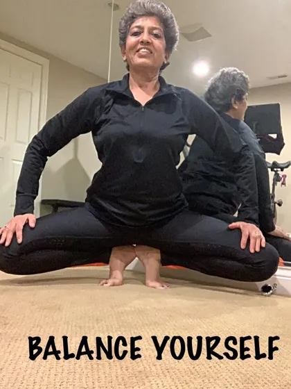 A low squatting balance pose. This asana builds incredible strength in the legs and requires deep focus.
