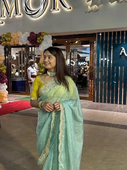 Attending an event in a beautiful organza saree.
