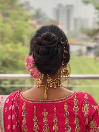 A back view of the messy bun, showcasing the intricate weaving of the hair and the placement of moon-shaped accessories for a unique touch.