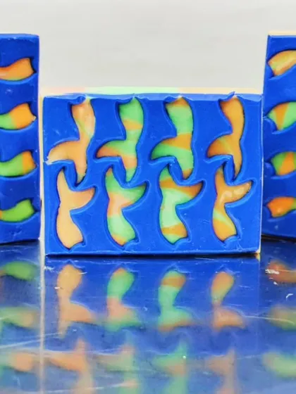 Another of my peekaboo soap attempts, this time with a tessellation of birds. The colorful swirl peeking through the blue soap dough is so playful.