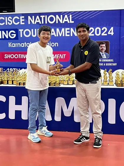 Presenting a trophy to a deserving winner at the CISCE National Shooting Tournament 2024 award ceremony.